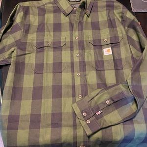 Carhart flame resistant green, and black flannel work shirt.